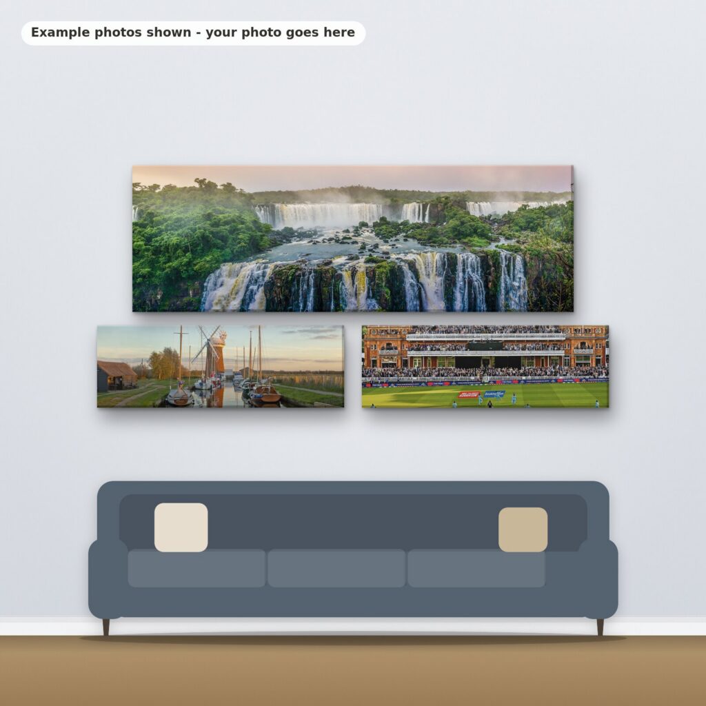 Example photos on three panoramic canvases hanging above a sofa