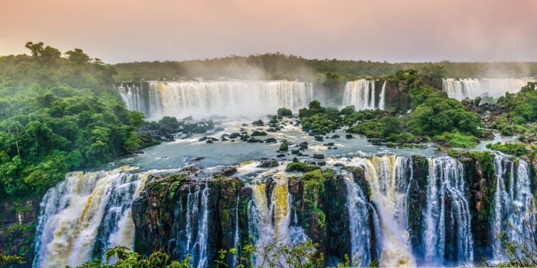 A wide panoramic photo of a waterfall